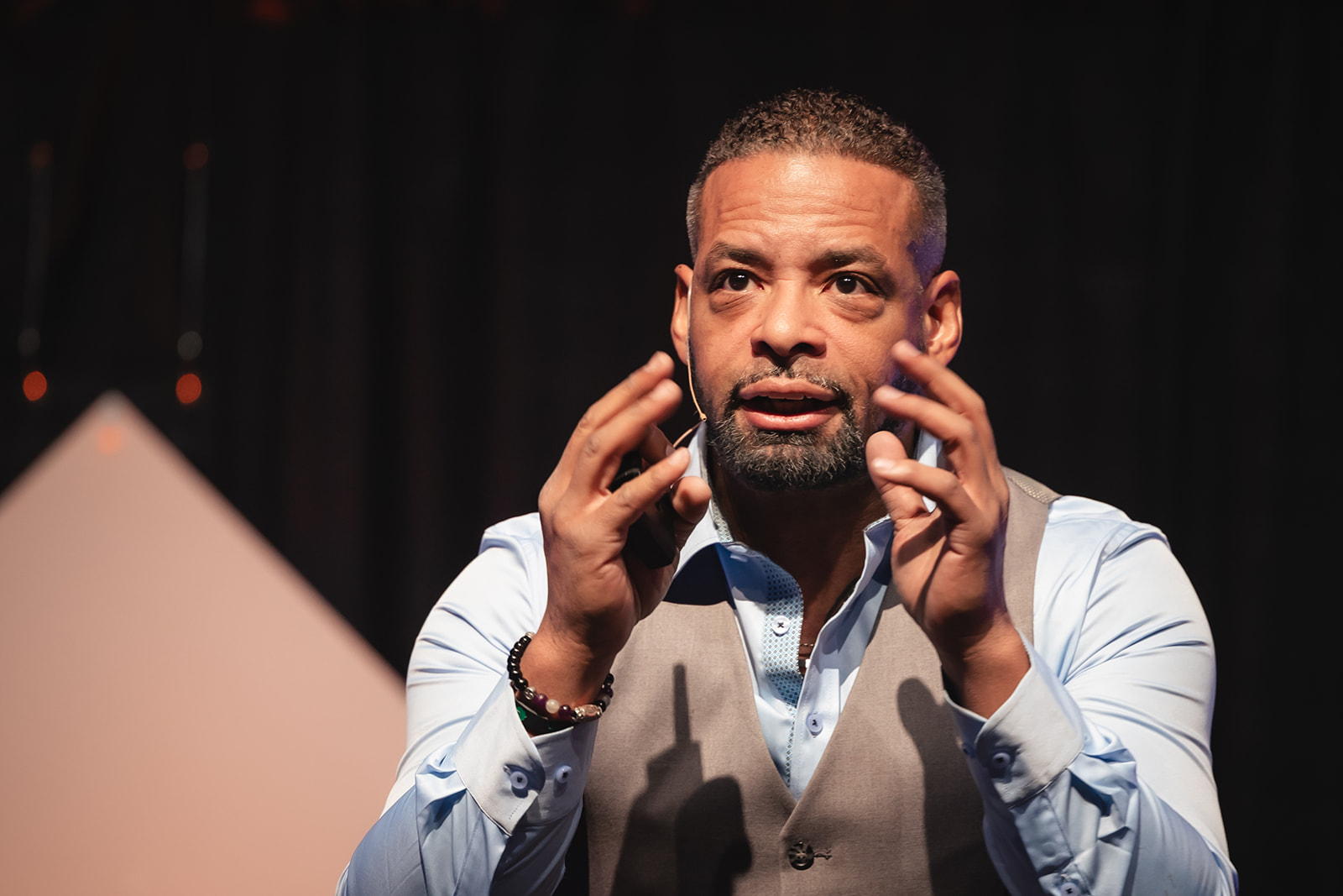 Dr. Stephen Crawford demonstrating grounded executive presence on stage