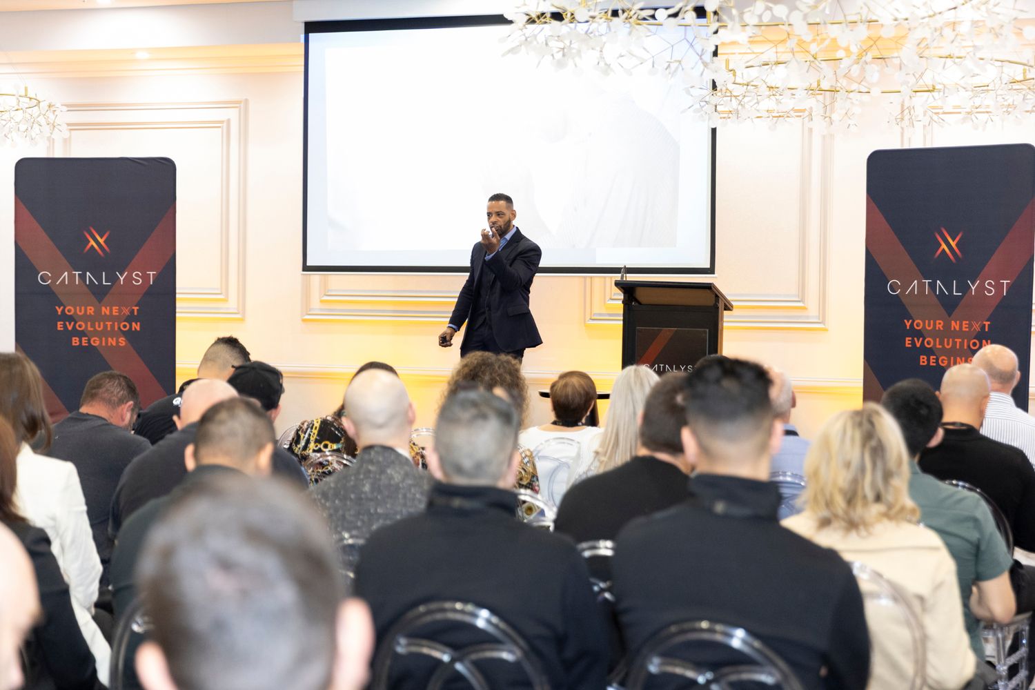 Dr. Stephen Crawford delivering a keynote presentation to an audience at a leadership event